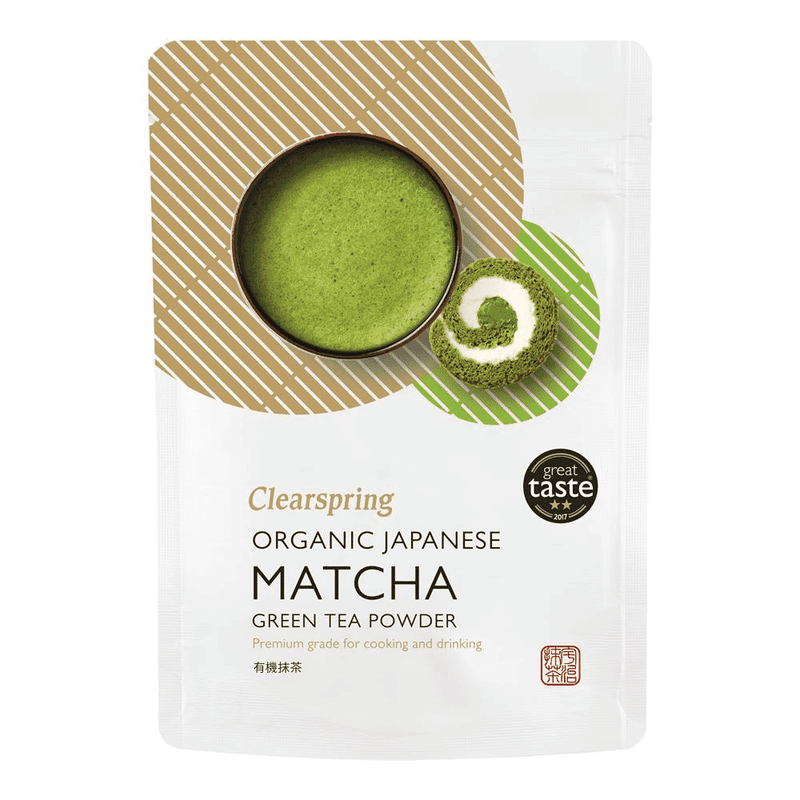 Organic Japanese Matcha green tea powder by Clearspring in a 100g package, shown in a clear container with vibrant green powder.