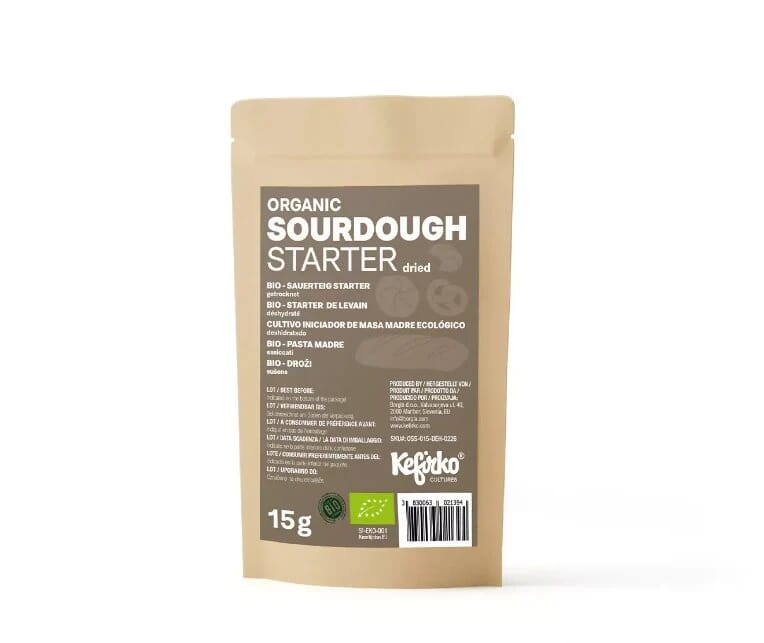 Kefirko Organic Sourdough Starter 15g in a small glass jar with a bubbly, active fermentation mixture for bread baking.