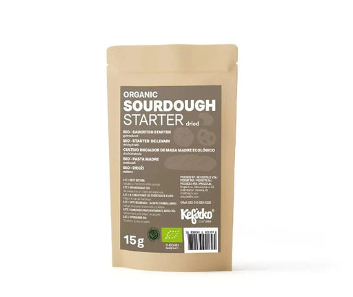 Kefirko Organic Sourdough Starter 15g in a small glass jar with a bubbly, active fermentation mixture for bread baking.