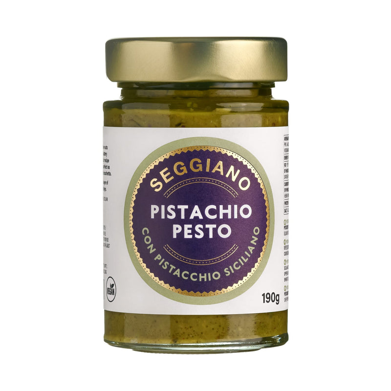 Seggiano Pistachio Pesto jar showing creamy green pistachio-based pesto with textured surface, 190g container on white background.